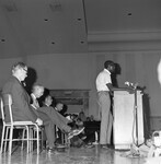 Harry Edwards speaks to an audience at a civil rights meeting. thumbnail