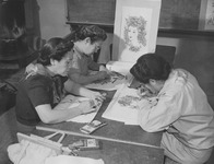 [Three students doing steamed crayon work for tablecloths and wall hangings in adult crafts class at Granada incarceration camp] thumbnail