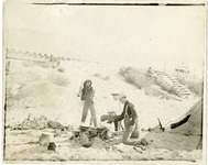 [Men cooking on the beach] thumbnail