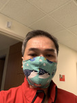 Photograph of Nurse Cuong Phu Pham in Ocean Print Face Mask thumbnail
