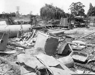 Debris and safe near railroad tracks thumbnail