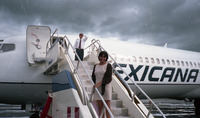 Michele Serros boarding an airplane thumbnail