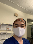 Photograph of Nurse Cuong Phu Pham in Mask and Brown Head Wrap thumbnail
