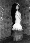 Female impersonator wearing a halter top dress. thumbnail
