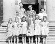 Children pose outside building thumbnail