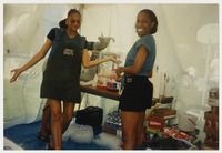 [Two Society of Black Business Students (SBBS) members inside Open House tent] thumbnail