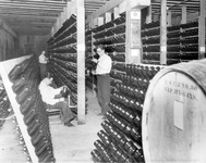 Examining bottles of wine thumbnail