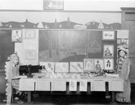 Two children in Native American dress beside classroom displays thumbnail