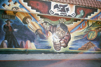 Chicano Mural Featuring Aztec Iconography, Cesar Chavez and Zoot Suit thumbnail