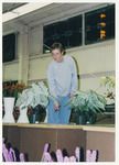[Person posing near flowers] thumbnail