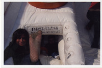 Michele Serros showing her foot thumbnail