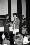 Woman receiving an award thumbnail