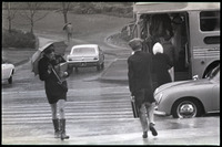 [Girl with umbrella and students boarding bus], 1969 thumbnail