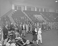 People gathered in an assembly hall at Grange convention thumbnail