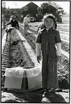 Girl helping her family plant strawberries, 1969 thumbnail