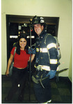 Michele Serros and a firefighter thumbnail