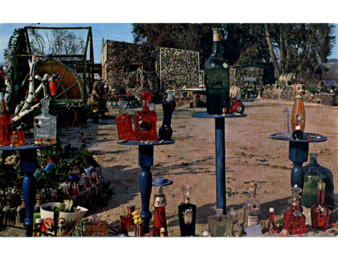 Colorful Bottles Lining a Walkway Inside Bottle Village thumbnail