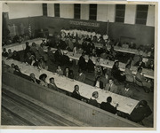 Attendees at banquet tables with a banner of the Citizen's Civic Club in background thumbnail