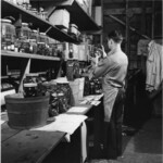 Ed Ricketts holding jar of specimens thumbnail
