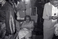 Woman sitting on a couch thumbnail