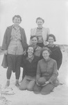 Women posing on a beach thumbnail