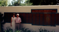 J. Handel Evans and Carol Evans in front of the Plaque for the Founding Members of the President's Circle thumbnail