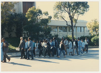 [Group marching on N. Perimeter Rd.] thumbnail