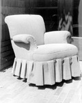 Upholstered chair with pleated skirt. thumbnail
