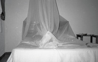 Michele and Gene under a mosquito net thumbnail