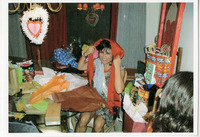 Michele Serros with gifts thumbnail