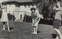 Female students playing golf. thumbnail