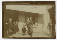 Man and Children Standing in front of Ah Louis Store thumbnail