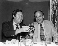 John Bunzel toasting with an unknown individual. thumbnail