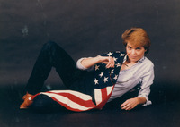 Claire Mix posing with the American Flag thumbnail