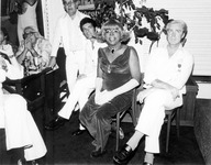 Billy DeFrank sitting with unidentified people. thumbnail
