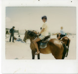 Michele Serros riding a horse thumbnail
