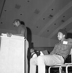 Harry Edwards at the podium delivering a speech. thumbnail