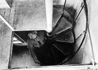 Faculty member climbing a stairway. thumbnail