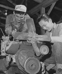 [George Baba and Tokiji Umeda overhauling a truck loader in motor pool repair section at Rohwer incarceration camp] thumbnail