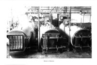 Cannery worker inspecting battery of retorts. thumbnail