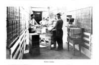 Cannery workers machine labeling cans. thumbnail