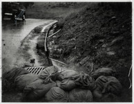 [Sandbags near drainage grate during flooding], 1973 [copy negative] thumbnail