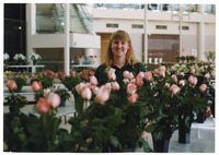[Woman standing among rose arrangements] thumbnail
