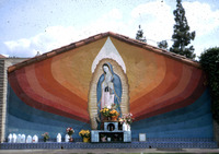 Virgin of Guadalupe Mural with Flowers and Offerings thumbnail