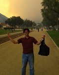 CI Student standing in the central mall with smoke in the background thumbnail