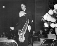 Two men stand before the assembly at the Grange convention thumbnail