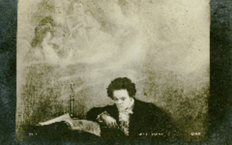Beethoven reading music in front of mural thumbnail
