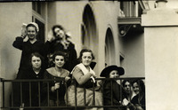Group of youth posing outside along a railing thumbnail