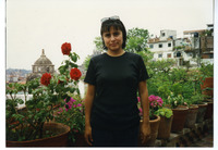 Michele Serros on a rooftop balcony thumbnail