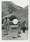 [Small child with balloon, walking away from Poly Canyon structure] thumbnail